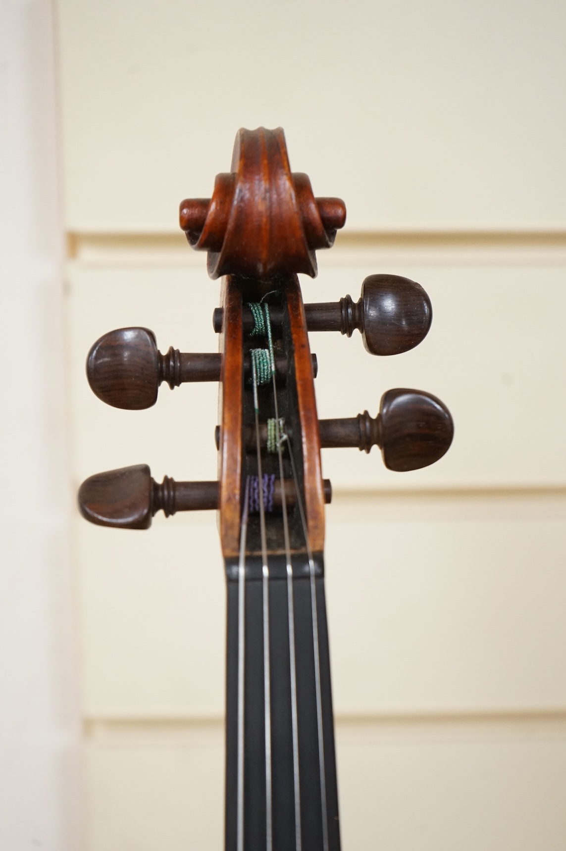 Three violins; a late 19th century German Stradivarius pattern violin, without label, a handmade violin (a.f.), with sound post crack, broken and repaired scroll, etc. and a Maidstone violin body, varnish stripped from t